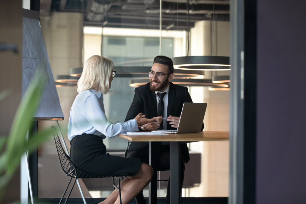 business consultant meeting with small business owner on financial training